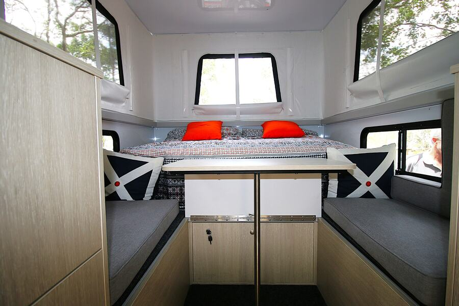 The dinette will seat four adults next to the Queen bed