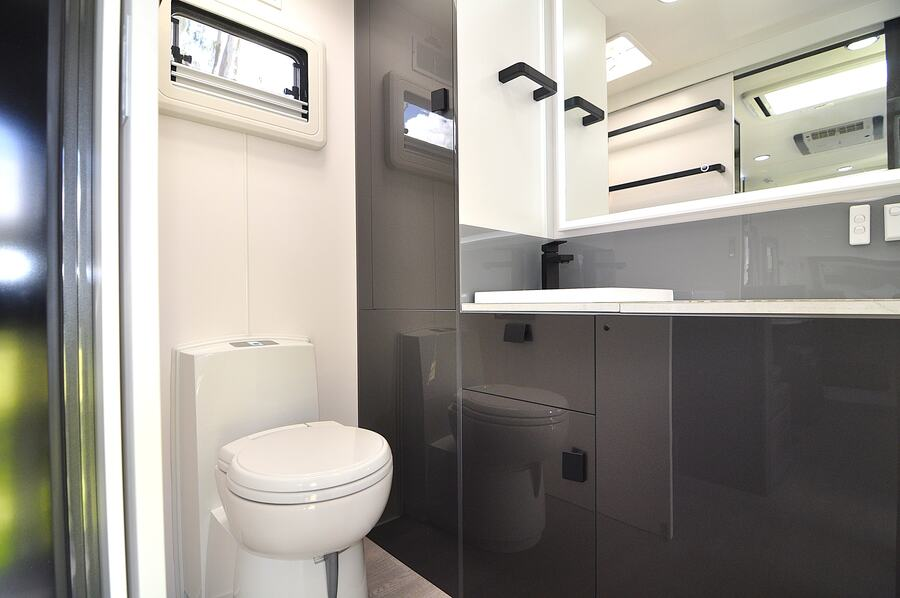 The ensuite bathroom is right on point, including hanging rails in this wonderful large van