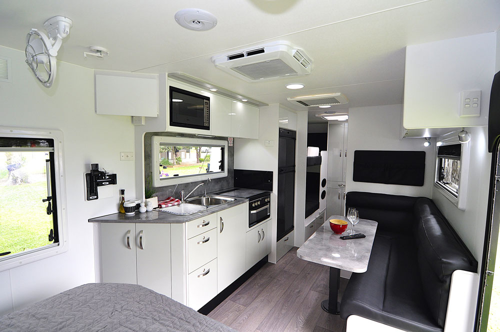 The extensive interior fit-out features plenty of storage space and a one-piece fibreglass roof.